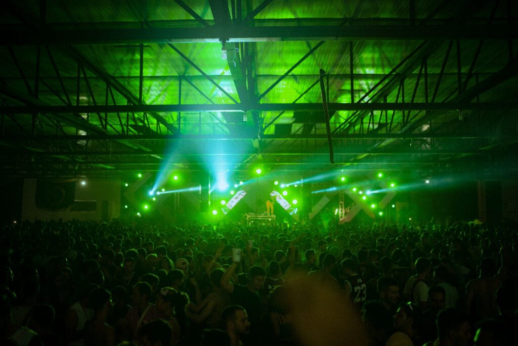 How Surge is turning fans into the festival industry's last hope — dark strobe lit underground rave crowd
