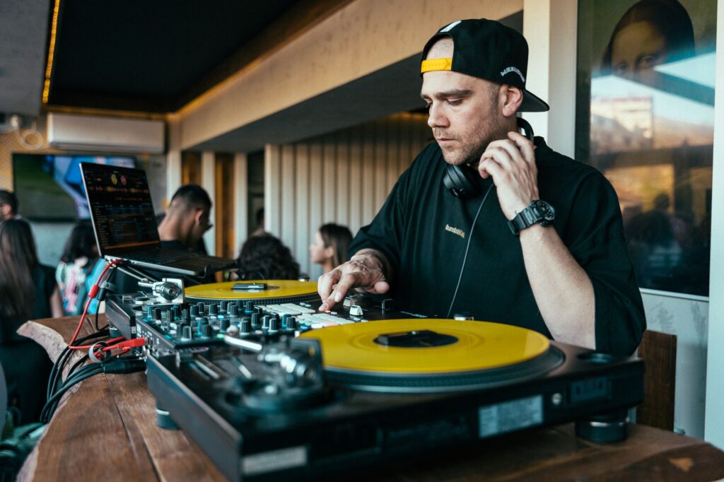 Why Armin van Buuren is pressing his own vinyl for Ibiza — dj playing vinyl records in front of a massive crowd strobe lights
