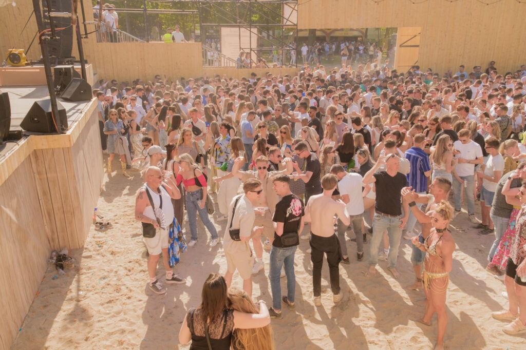 The secret cry for home inside Avicii's Hey Brother — massive outdoor music festival crowd hands in air