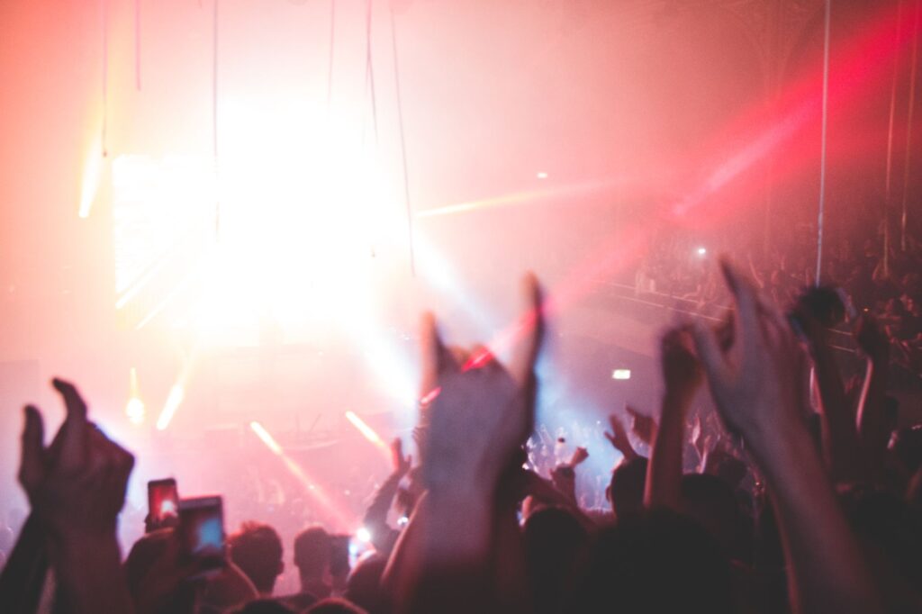 The agonizing heartbreak behind Alice Deejay's global anthem — euphoric music festival crowd lasers hands up