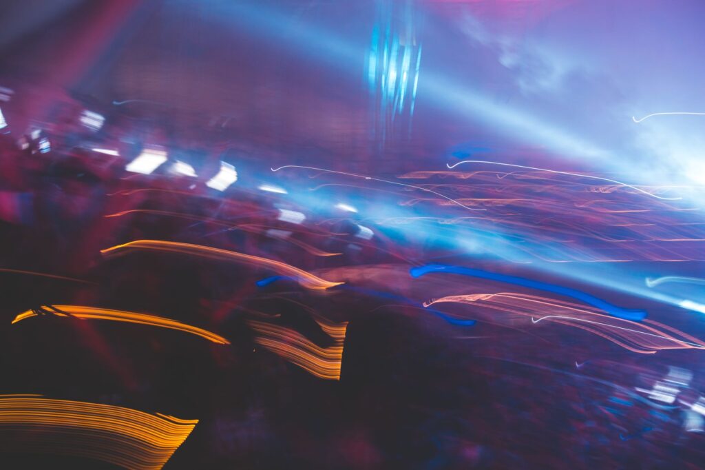 Why Deadmau5 and the legacy of Strobe still save us — dark atmospheric rave crowd looking at lights